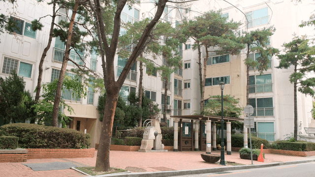 Apartment complex with trees and pavilions