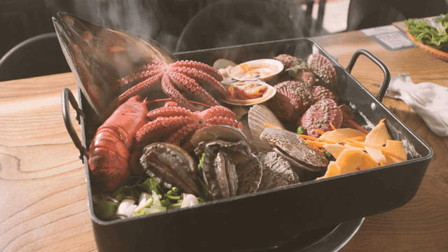 Steaming pot of assorted seafood