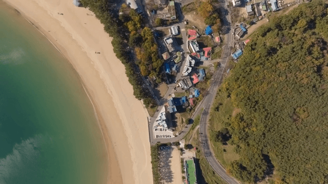 Aerial view of a coastal village and beach