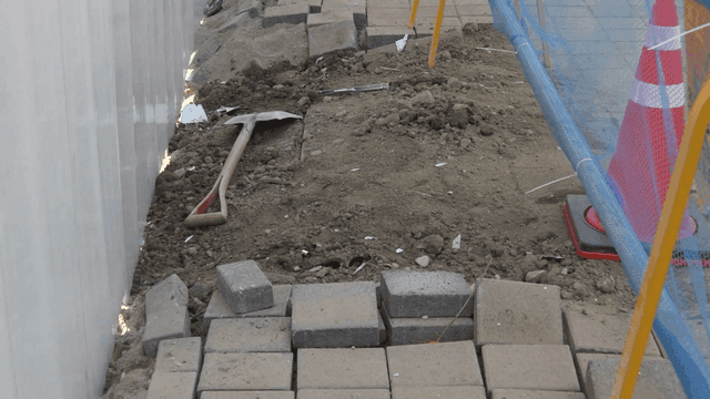 Sidewalk under construction with barriers